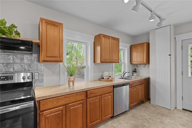 183 Annaquatucket Rd, North Kingstown, RI 02852 - kitchen with stainless steel appliances, a sink, ventilation hood, rail lighting, and light countertops