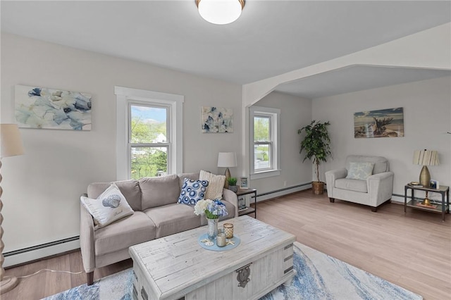 183 Annaquatucket Rd, North Kingstown, RI 02852 - living area featuring a baseboard heating unit, healthy amount of natural light, and wood finished floors