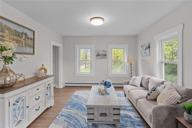 183 Annaquatucket Rd, North Kingstown, RI 02852 - living room featuring plenty of natural light, baseboard heating, and wood finished floors