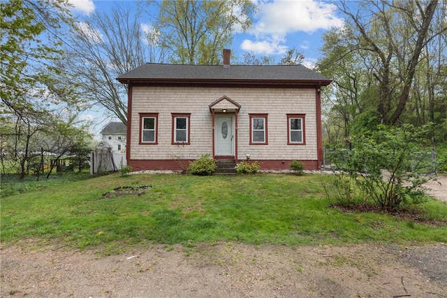 183 Annaquatucket Rd, North Kingstown, RI 02852 - view of front of property with entry steps, a front yard, a shingled roof, and a chimney