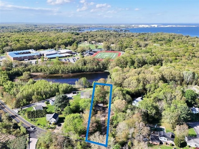 183 Annaquatucket Rd, North Kingstown, RI 02852 - aerial view of property and surrounding area with a forest, a nearby body of water, and property parcel outlined