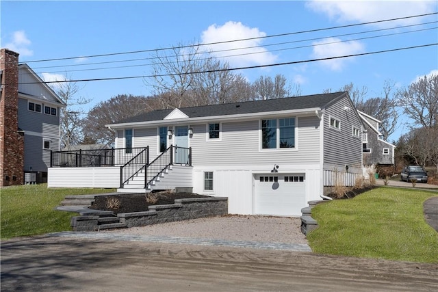 9 Stedman Rd, South Kingstown, RI 02879 - view of front of home featuring an attached garage, gravel driveway, a front lawn, and roof with shingles