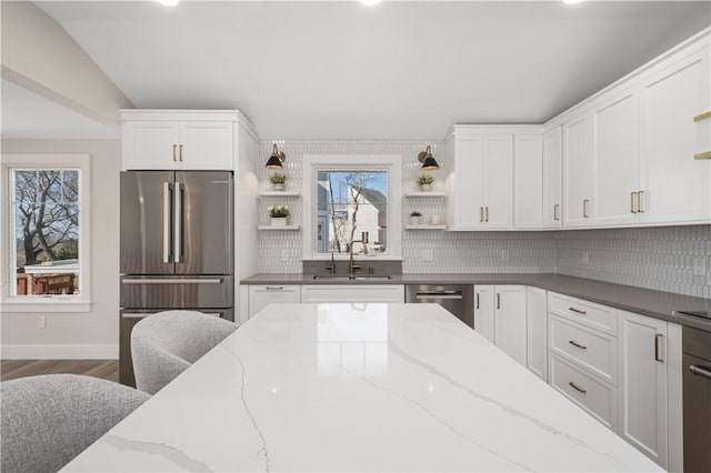 9 Stedman Rd, South Kingstown, RI 02879 - kitchen with open shelves, stainless steel appliances, white cabinetry, tasteful backsplash, and recessed lighting