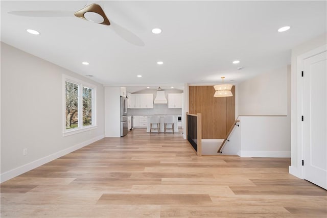 9 Stedman Rd, South Kingstown, RI 02879 - unfurnished living room with recessed lighting and light wood finished floors