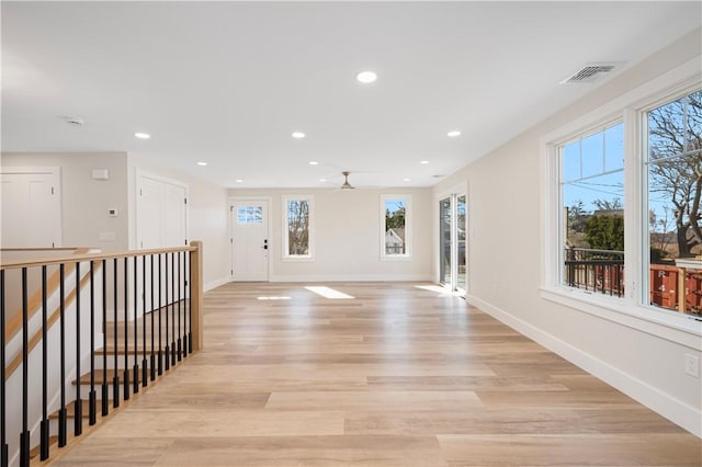 9 Stedman Rd, South Kingstown, RI 02879 - hallway with light wood-type flooring, recessed lighting, and an upstairs landing