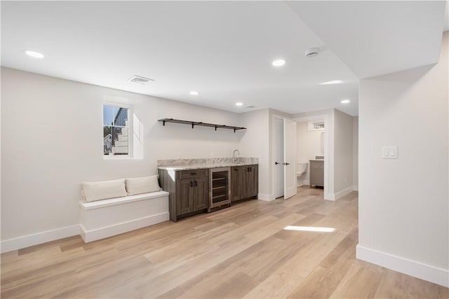 9 Stedman Rd, South Kingstown, RI 02879 - indoor wet bar with beverage cooler, recessed lighting, and light wood-style floors