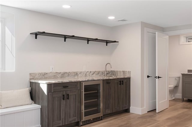 9 Stedman Rd, South Kingstown, RI 02879 - indoor wet bar with beverage cooler, light wood-style floors, and recessed lighting