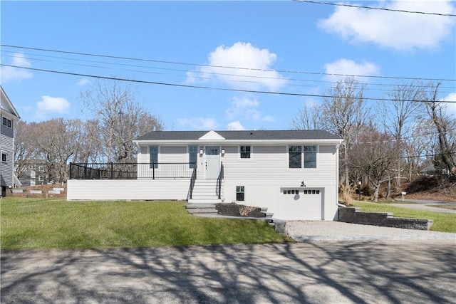 9 Stedman Rd, South Kingstown, RI 02879 - view of front of property with a garage, a front yard, and gravel driveway