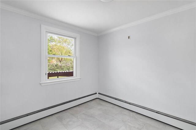spare room with ornamental molding and a baseboard radiator