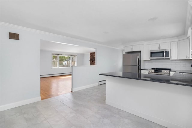 kitchen featuring stainless steel appliances, ornamental molding, a baseboard radiator, white cabinetry, and tasteful backsplash