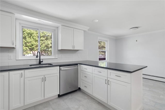 kitchen featuring dishwasher, a sink, a peninsula, white cabinets, and ornamental molding