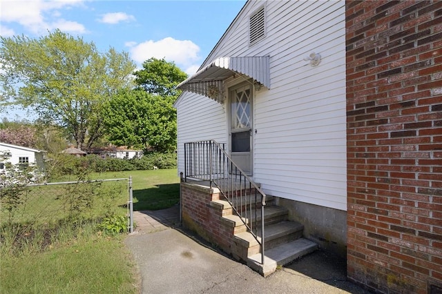 view of property exterior featuring fence