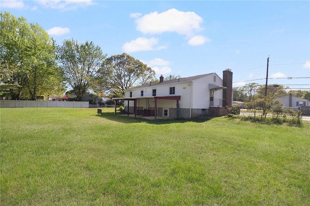 rear view of house featuring a chimney