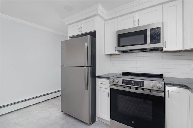 kitchen featuring stainless steel appliances, a baseboard radiator, ornamental molding, backsplash, and white cabinetry