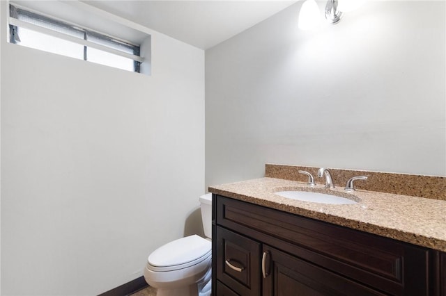 half bath with toilet and vanity