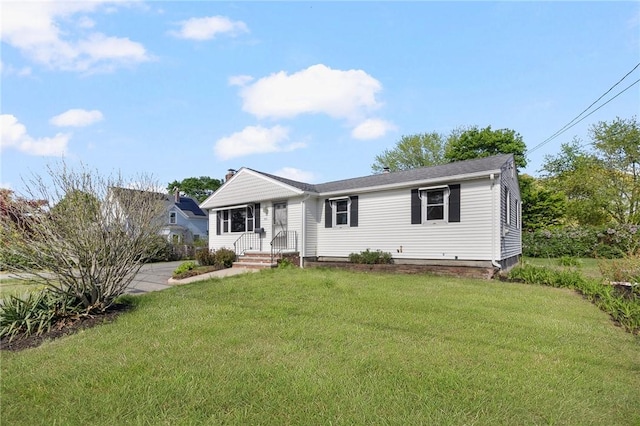 view of front of property with a front lawn