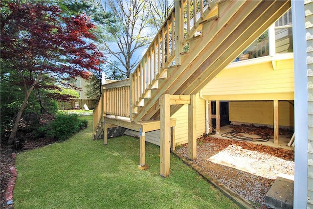 view of grassy yard with stairs