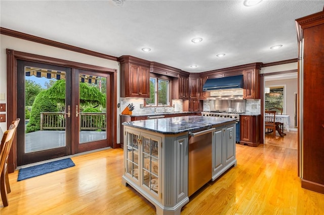 831 N Quidnessett Rd, North Kingstown, RI 02852 - kitchen with custom exhaust hood, dishwasher, tasteful backsplash, light wood-style floors, and ornamental molding