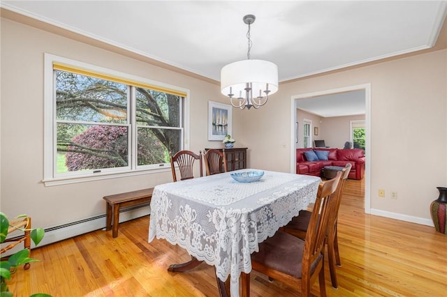 831 N Quidnessett Rd, North Kingstown, RI 02852 - dining space featuring a chandelier, light wood finished floors, ornamental molding, baseboards, and a baseboard heating unit
