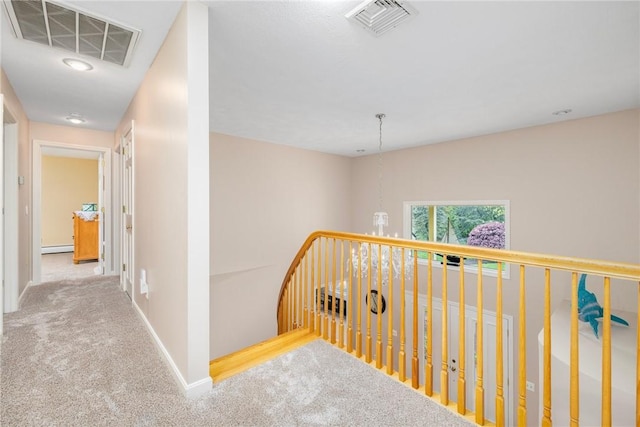 831 N Quidnessett Rd, North Kingstown, RI 02852 - hall featuring carpet floors, a baseboard heating unit, baseboards, and an upstairs landing