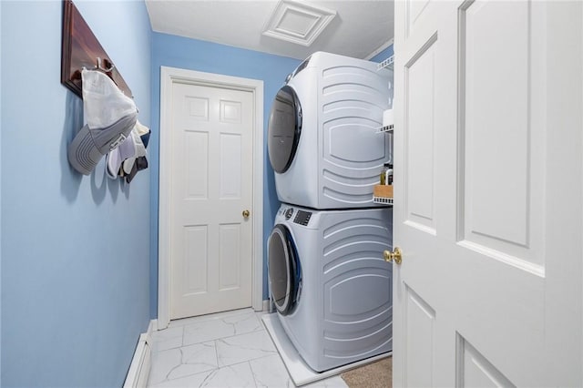 831 N Quidnessett Rd, North Kingstown, RI 02852 - laundry room featuring stacked washing machine and dryer, light marble finish floors, and baseboards