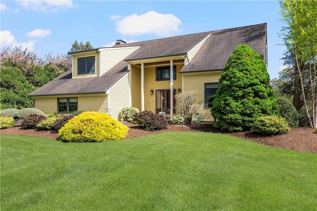 831 N Quidnessett Rd, North Kingstown, RI 02852 - view of front of home featuring a front yard, roof with shingles, and a chimney
