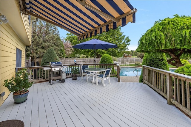 831 N Quidnessett Rd, North Kingstown, RI 02852 - wooden deck featuring a grill, outdoor dining space, and a fenced backyard