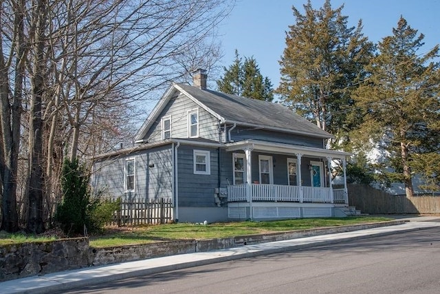 16 Gough Ave, West Warwick, RI 02893 - view of front facade featuring a porch, a chimney, and fence