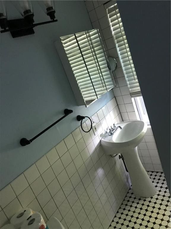 16 Gough Ave, West Warwick, RI 02893 - bathroom featuring tile walls and tile patterned floors