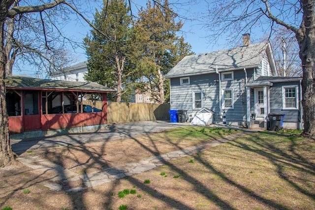 16 Gough Ave, West Warwick, RI 02893 - rear view of property with a chimney