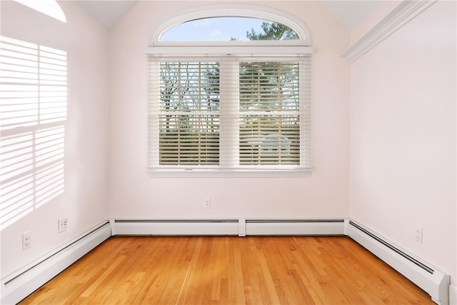 38 Miss Fry Dr, East Greenwich, RI 02818 - unfurnished room with vaulted ceiling, healthy amount of natural light, baseboard heating, and wood finished floors
