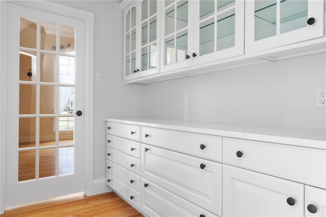 38 Miss Fry Dr, East Greenwich, RI 02818 - bar area with baseboards and light wood-style floors