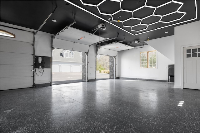 38 Miss Fry Dr, East Greenwich, RI 02818 - garage with a garage door opener and baseboards