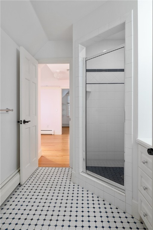 38 Miss Fry Dr, East Greenwich, RI 02818 - full bath featuring a baseboard heating unit, a stall shower, tile patterned floors, and vaulted ceiling