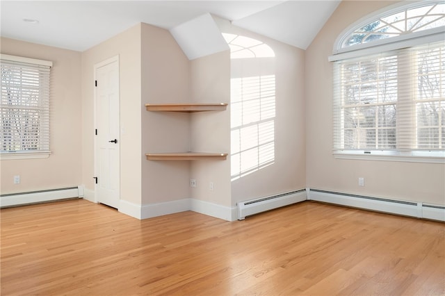 38 Miss Fry Dr, East Greenwich, RI 02818 - empty room featuring baseboard heating, wood finished floors, lofted ceiling, and baseboards