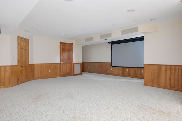 38 Miss Fry Dr, East Greenwich, RI 02818 - spare room featuring wainscoting, wooden walls, and carpet