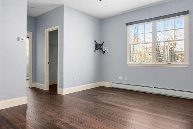 38 Miss Fry Dr, East Greenwich, RI 02818 - unfurnished room with a baseboard heating unit, dark wood finished floors, and baseboards