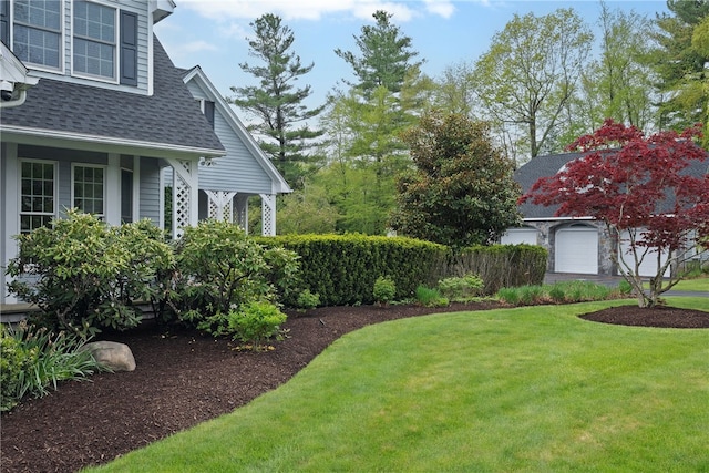 38 Miss Fry Dr, East Greenwich, RI 02818 - view of grassy yard with a garage