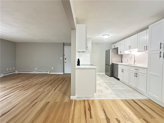300 Smithfield Rd Unit B3-18, North Providence, RI 02904 - kitchen featuring a sink, light wood-style floors, light countertops, and appliances with stainless steel finishes