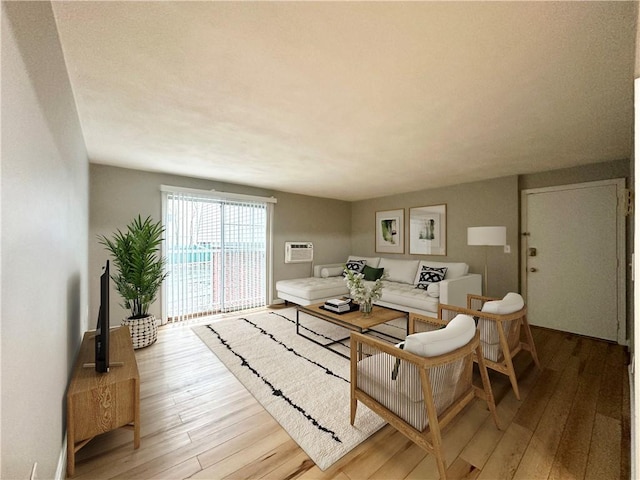 300 Smithfield Rd Unit B3-18, North Providence, RI 02904 - living room featuring wood-type flooring and a wall mounted AC