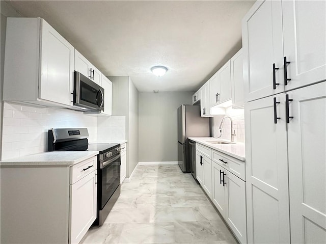300 Smithfield Rd Unit B3-18, North Providence, RI 02904 - kitchen with appliances with stainless steel finishes, a sink, light countertops, and light marble finish flooring