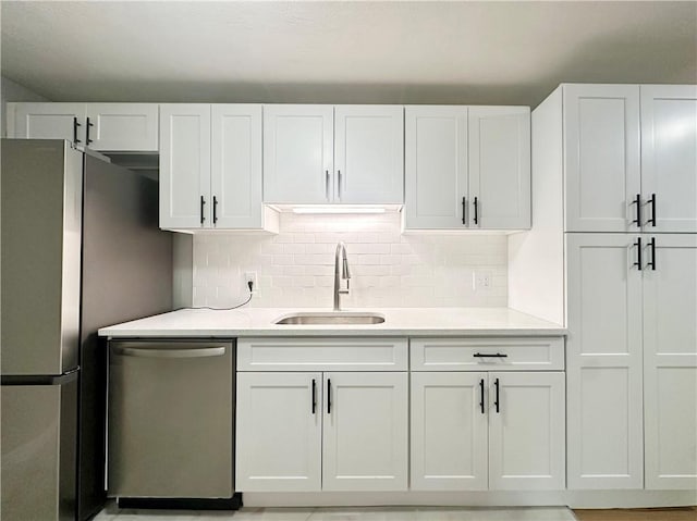 300 Smithfield Rd Unit B3-18, North Providence, RI 02904 - kitchen with stainless steel appliances, a sink, decorative backsplash, and white cabinets