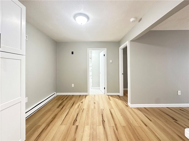 300 Smithfield Rd Unit B3-18, North Providence, RI 02904 - empty room with baseboard heating, light wood-type flooring, a smoke detector, and baseboards