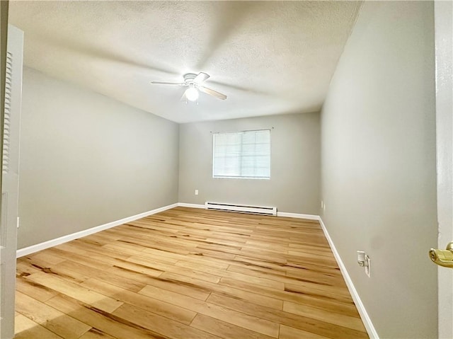 300 Smithfield Rd Unit B3-18, North Providence, RI 02904 - unfurnished room featuring a baseboard radiator, ceiling fan, light wood finished floors, baseboards, and a textured ceiling