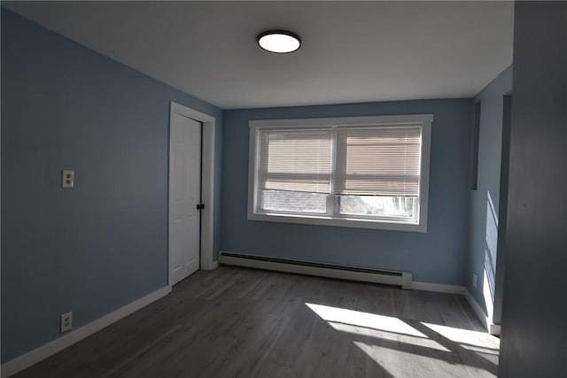 115 Sherman Farm Rd, Burrillville, RI 02830 - unfurnished room featuring a baseboard heating unit, baseboards, and wood finished floors