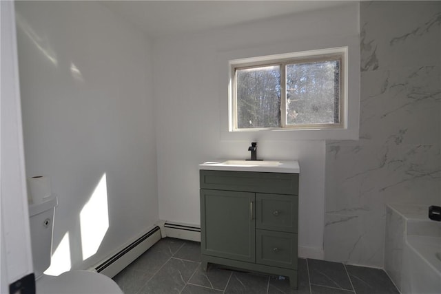 115 Sherman Farm Rd, Burrillville, RI 02830 - full bathroom featuring baseboard heating, a tub to relax in, vanity, and marble finish floors