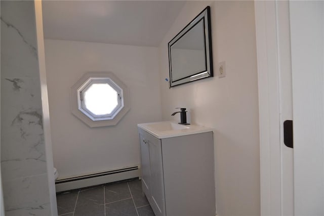 115 Sherman Farm Rd, Burrillville, RI 02830 - bathroom featuring a baseboard heating unit, vanity, tile patterned flooring, and toilet