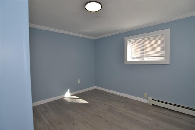 115 Sherman Farm Rd, Burrillville, RI 02830 - empty room with baseboard heating, ornamental molding, wood finished floors, and baseboards