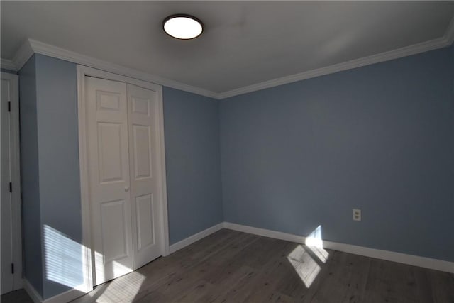 115 Sherman Farm Rd, Burrillville, RI 02830 - unfurnished bedroom with wood finished floors, baseboards, a closet, and ornamental molding