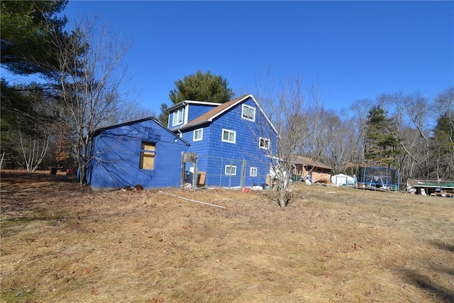 115 Sherman Farm Rd, Burrillville, RI 02830 - view of home's exterior with a trampoline